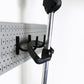Grey Pegboard for Holding Lawn Equipment and Gardening Tools