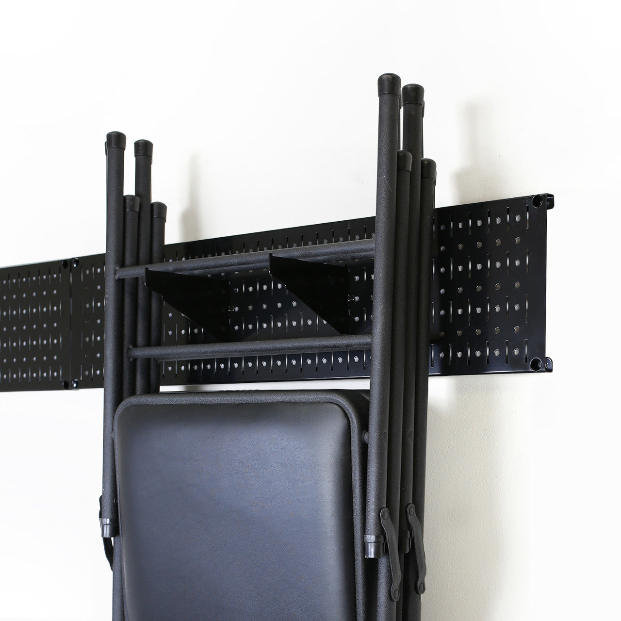 Hang Folding Chairs on Black Metal Pegboard