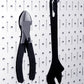 Tools on White Pegboard