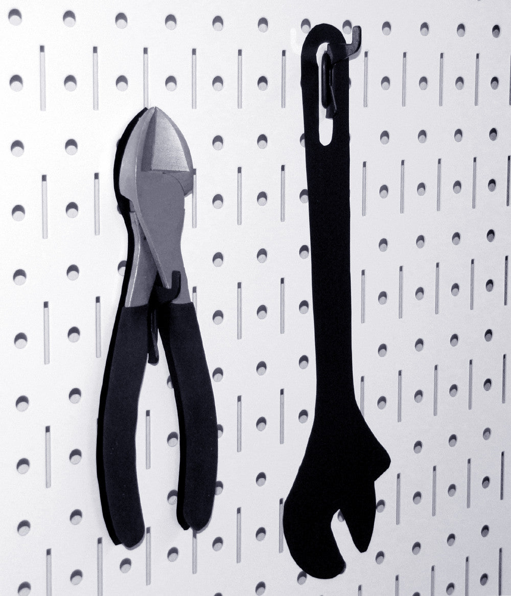 Tools on White Pegboard