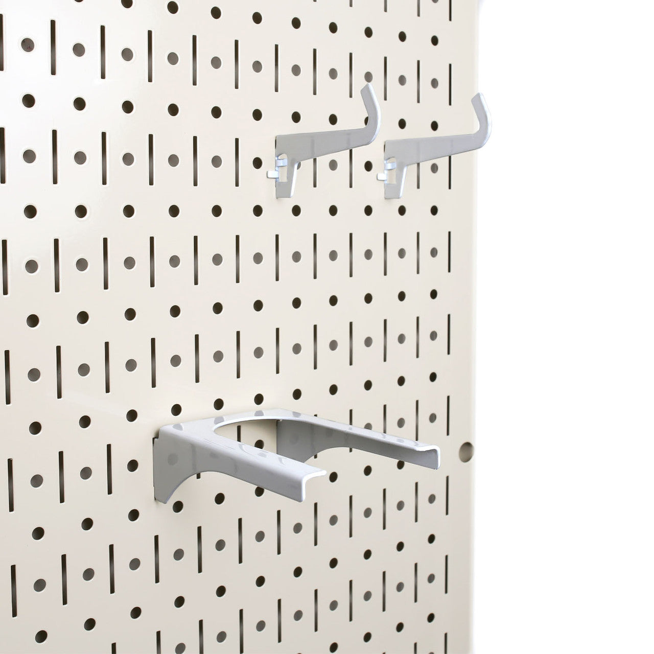 sand color metal peg board with white pegboard hooks